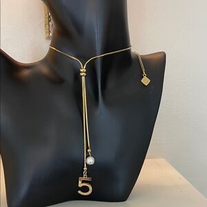 Chanel Elegant Gold Necklace with Pearl and Number Pendant